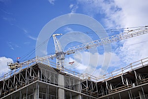 Building construction site with crane - construction machinery