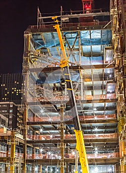 Building construction site with crane at night time - Sendai, Miyagi, Japan