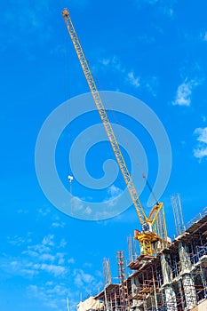 Building construction site with crane tower machinery