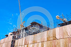 Building construction site with crane tower machinery