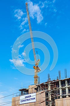 Building construction site with crane tower machinery