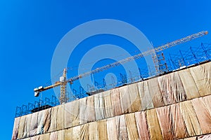 Building construction site with crane tower machinery