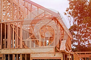 Building construction, wood framing new home under construction roof being built