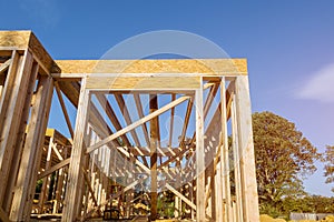 Building construction, wood framing new home under construction roof being built