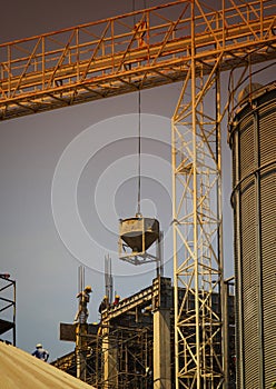 Building construction worker working on construction site with h