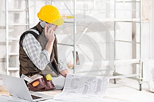 Building contractor talking on a mobile phone