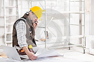 Building contractor talking on a mobile phone