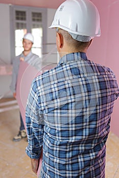 2 building contractors working on site