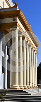A building with corinthian columns in a row colonnade The neoclassical building style resembles a law court  courthouse,