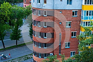 Building corner round top view with street and people and windows