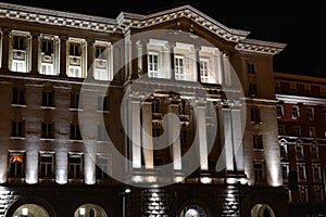 Building of Council of Ministers in Sofia, Bulgaria at night. Text Council of ministers in Bulgarian on the building