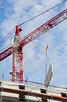 Building crane with prefab wall