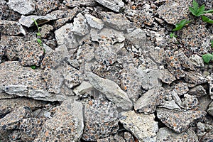 Building debris from broken gray pieces of asphalt photo