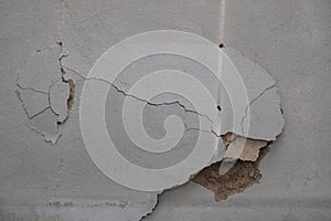 Building defect - damaged wall paint.