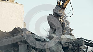 Building demolition procedure, high reach excavator eliminating old construction