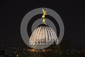 Building dome with a golden statue dresden germany at night