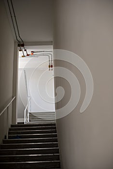 Building Emergency Exit. Stairwell fire escape in a modern residential building.