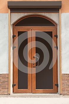 Building entrance with brown external door
