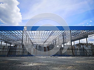 Building of extension of the existing factory unfinished steel roof structure