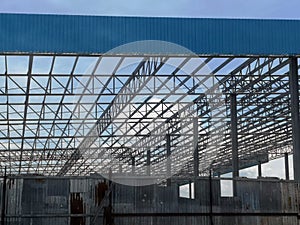 Building of extension of the existing factory unfinished steel roof structure