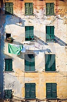 Building facade hanging cloths. Italy