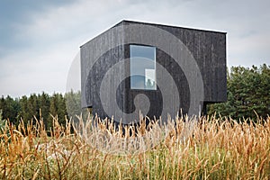 Building facade made of burnt wooden boards.