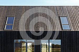 Building facade made of burnt wooden boards.