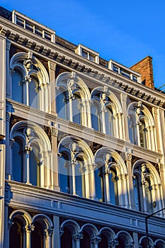 Building facade with a series of decorative heads, London