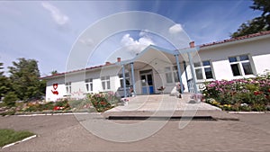 Building of feldshers station and flowerbeds on street