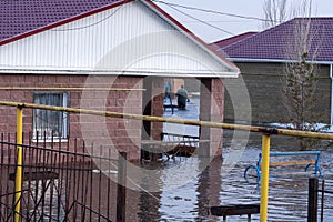 Building is flooded by waters overflowing river. Natural disaster.
