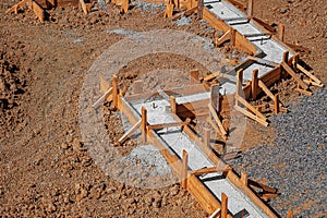 A building foundation with wooden formwork