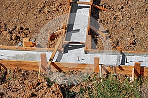 A building foundation with wooden formwork