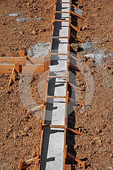 A building foundation with wooden formwork