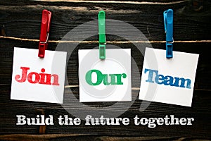 Building the future together, join our team in squre paper notes hanging by clothespin