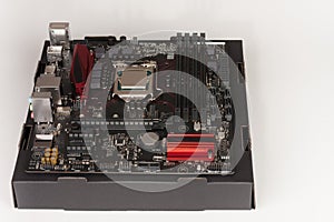 Building of gaming PC, motherboard with installing CPU.