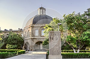 Building of the Gevorgyan Spiritual Academy with the ancient khachkar