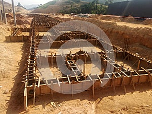 Building ground beam under construction using temporary timber plywood formwork at the site.