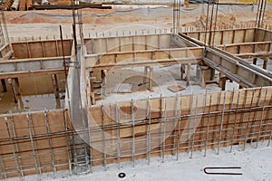 Building ground beam under construction using temporary timber plywood formwork at the site.