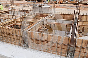 Building ground beam under construction using temporary timber plywood formwork at the site.
