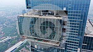 Building a high-rise building, view of a skyscraper under construction - the concept of real estate construction