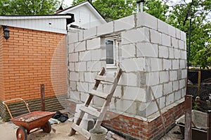 Building home addition from aerated autoclaved concrete blocks to a brick house