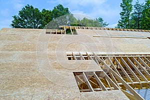 Building a home with under construction and framing new wooden roof beams