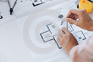 A building and house architect is reviewing and revising the house designs of a large housing project, he draws roundabouts on the