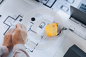 A building and house architect is reviewing and revising the house designs of a large housing project, he draws roundabouts on the