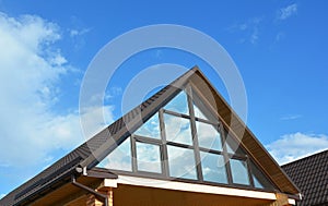 Building house attic conservatory terrace on the home roof. Conservatory or greenhouse roofing. Attic Exterior