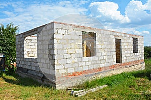 Building House from Autoclaved Aerated Concrete Blocks with concrete lintel and Unfinished Roof.