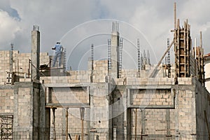 Building house with concrete blocks and columns