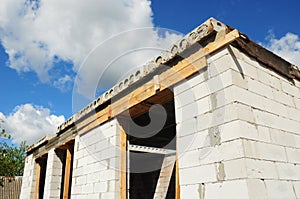 Building house construction. Windows concrete lintel with iron bar on brick unfinished house construction.