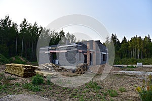 Building a house of expanded-clay concrete blocks. Unfinished private home of ceramsite concrete blocks on a construction site.