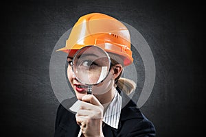 Building inspector looking through magnifier